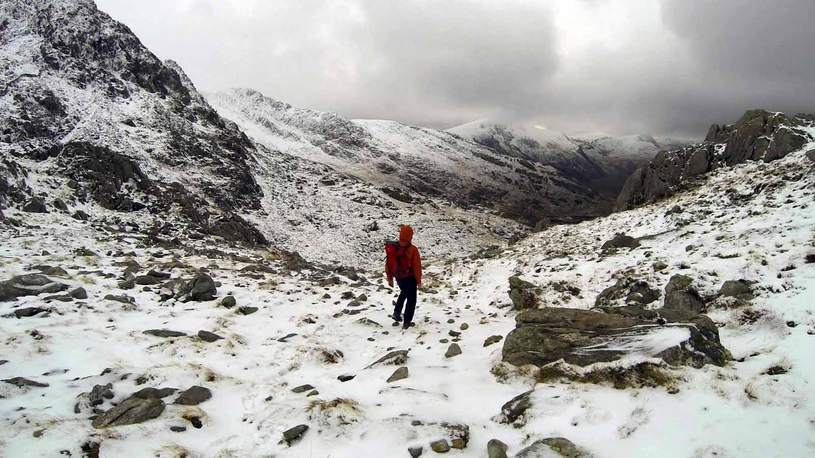 Picture of the author descending a snow dusted and deserted Moel Hebog in western Snowdonia.